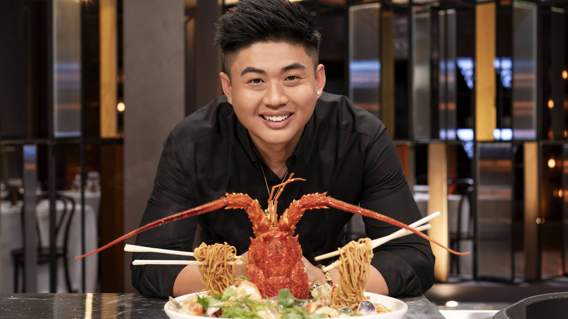 Chef Vincent Yeow Lim expertly preparing a gourmet dish in a professional kitchen