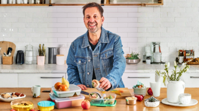 George Georgievski preparing healthy lunchbox food in a kitchen.