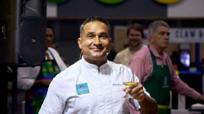 Chef Peter Kuruvita holding a glass of tea at the Dilmah Tea School during the Good Food and Wine Show