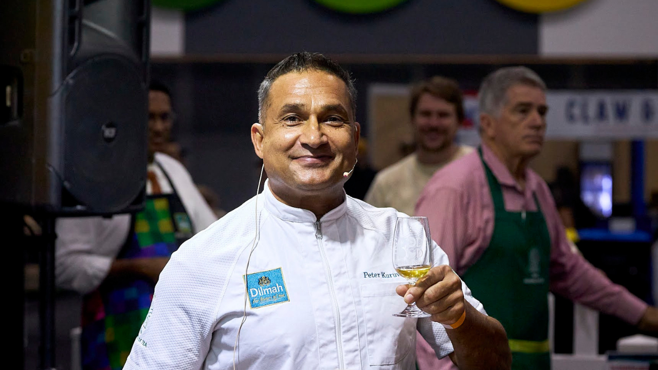 Chef Peter Kuruvita holding a glass of tea at the Dilmah Tea School during the Good Food and Wine Show