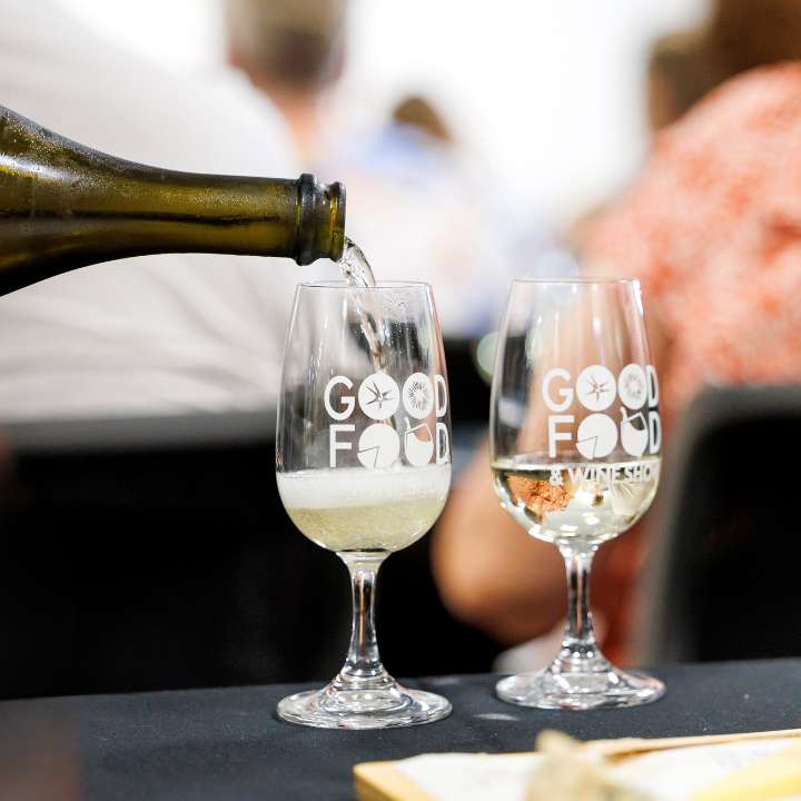 White wine being poured into a tasting glass during the Cheese & Wine in the Dark masterclass at the Good Food & Wine Show.