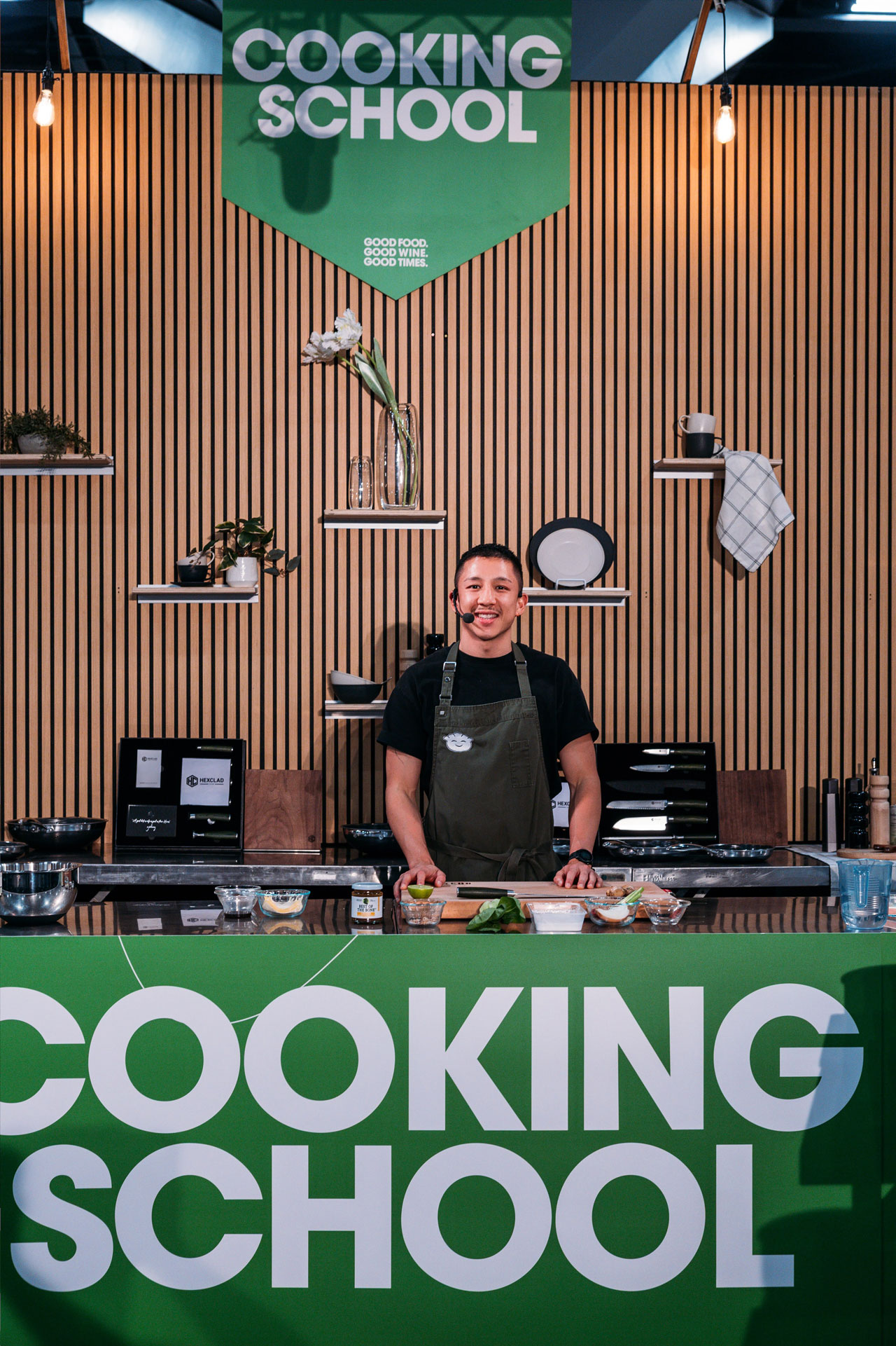 Chef Brendan Pang showcases dumpling-making techniques with a smile on the main stage at the Good Food & Wine Show.