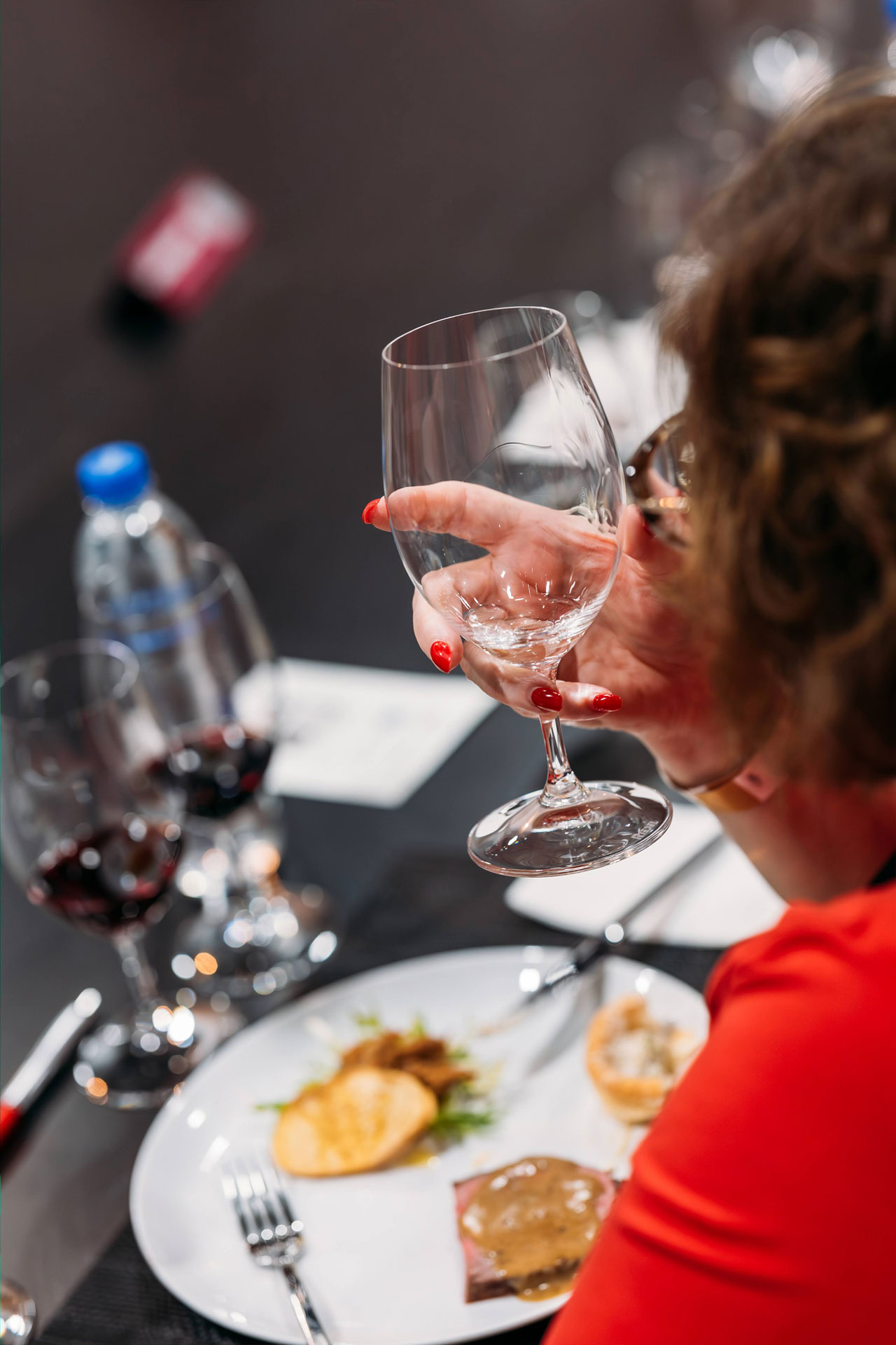 A Wine Selectors host guides guests through a curated wine tasting experience.