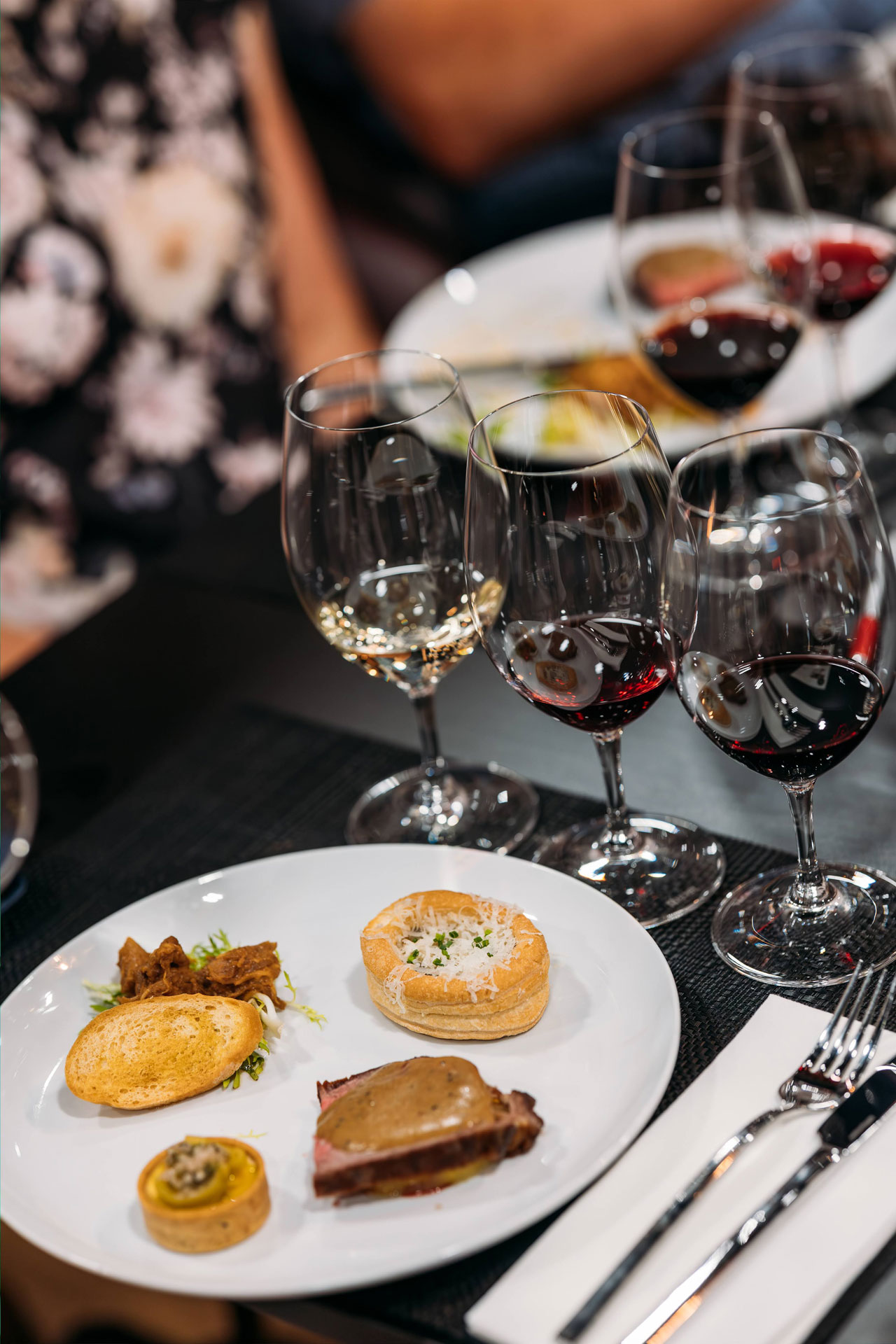 A Wine Selectors host guides guests through a curated wine tasting experience.