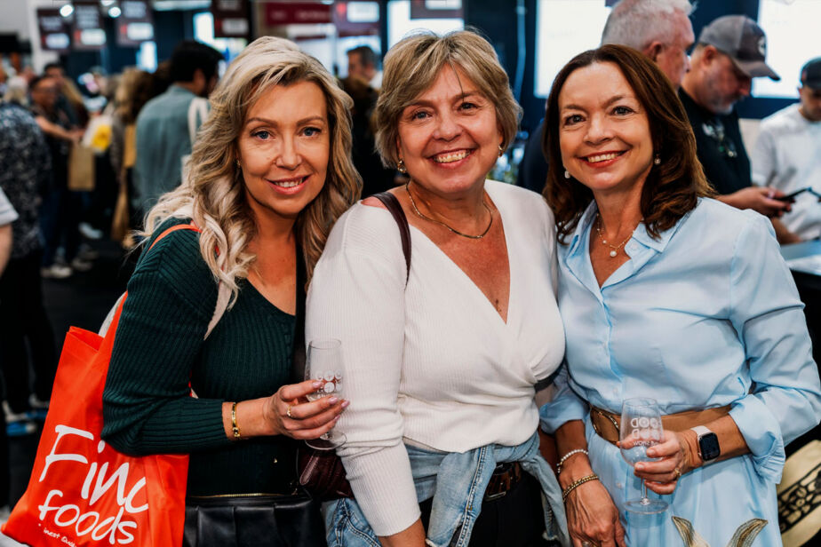 Three Woman smiling, enjoying the tasting experiences at the Good Food & Wine Show.