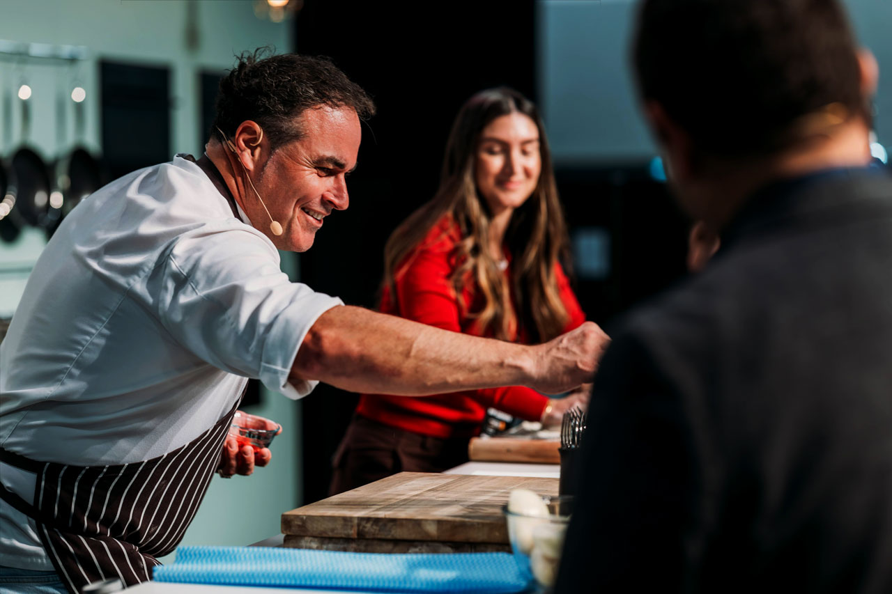 Renowned Miguel Maestre presents her impressive Live cooking on stage at the Good Food & Wine Show Christmas Market. With a playful look of surprise, she delights the audience during a live cooking demonstration, highlighting the festive spirit, expert talent and creative culinary experiences that make the Christmas Market a must-attend seasonal food event.