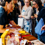 Visitor enjoying food tasting at Good Food And Wine Show in Sydney for the Christmas Show