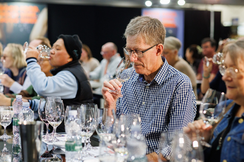 Visitor at the Good Food & Wine Show Drinks Lap enjoying wine tasting