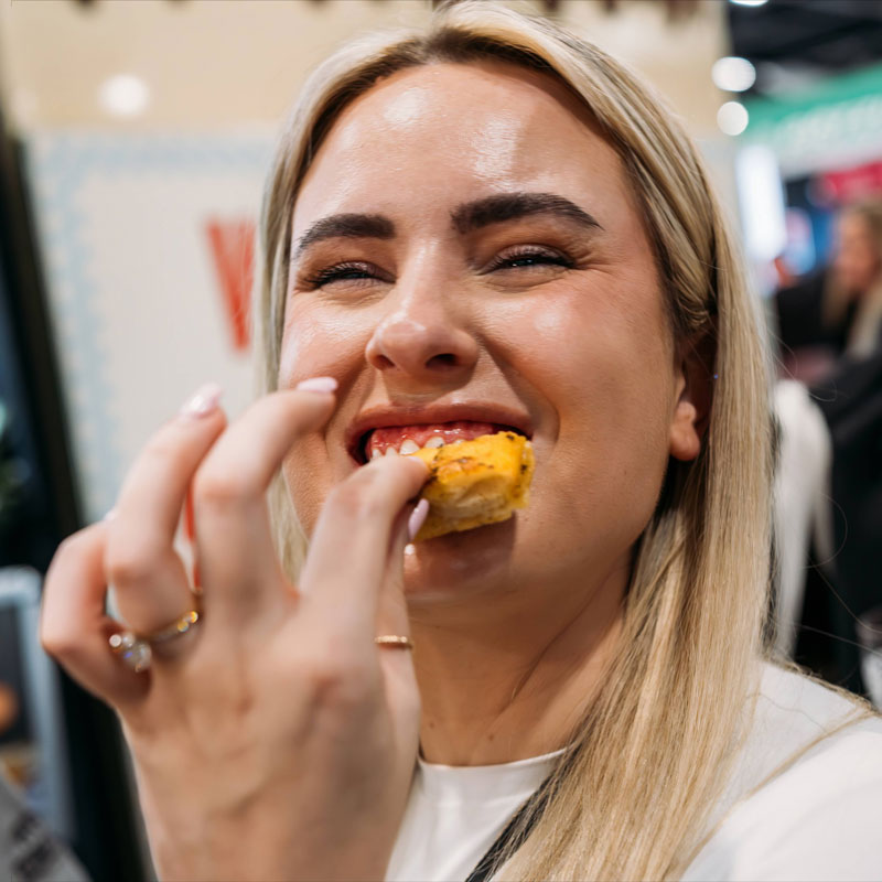 Person tasting sweets at the Good Food & Wine Show