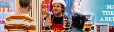 Visitors at the Good Food & Wine Show christmas Edition enjoying wine tasting