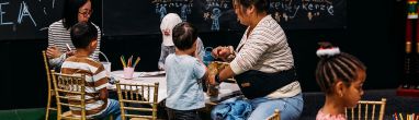 Kids and Parents at the Good Food & Wine Show christmas Edition enjoying wine tasting