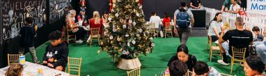 Kids and Parents at the Good Food & Wine Show christmas Edition enjoying wine tasting