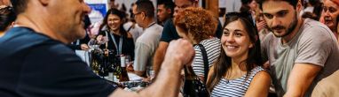 Visitors at the Good Food & Wine Show christmas Edition enjoying wine tasting