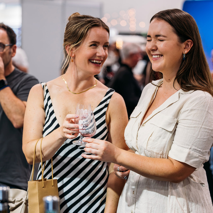 Friends enjoy sampling premium Great Southern wines at the Western Australian Wine Pavilion during the Good Food & Wine Show.